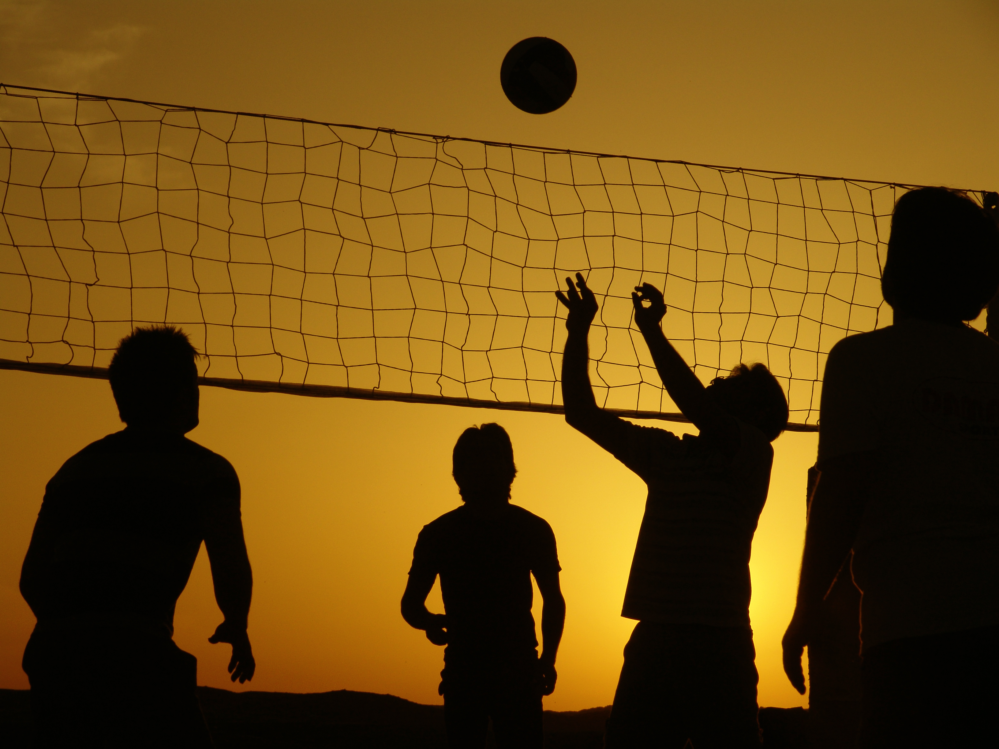 Volleyball Players at Sunset